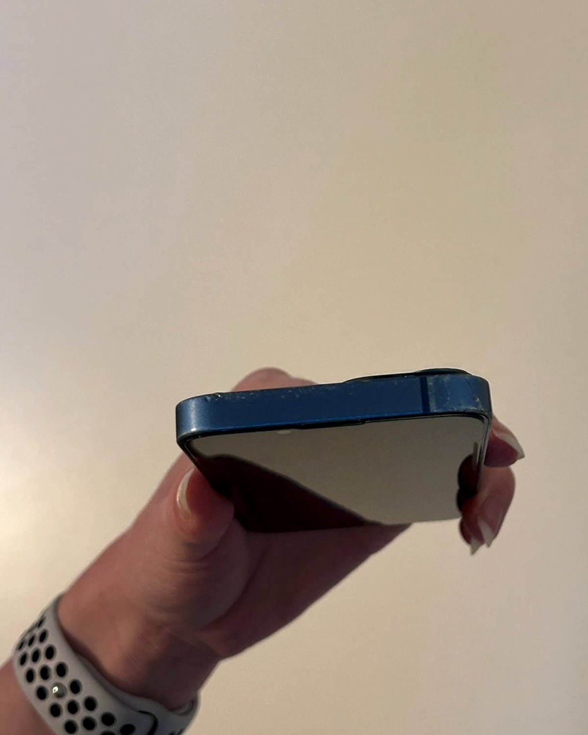 The bottom edge of an iPhone, showing the charging port