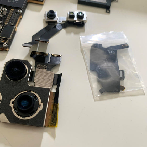 Rear camera modules and a front camera flex, ready to go back in.